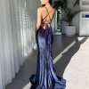 navy velvet gown with super plunge neckline, mermaid silhouette with a train, and lace up exposed back