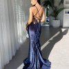 navy velvet gown with super plunge neckline, mermaid silhouette with a train, and lace up exposed back