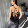 black velvet gown with super plunge neckline, mermaid silhouette with a train, and lace up exposed back