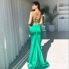 emerald formal gown with stylish straight neckline, thin straps, lace-up back and full sweeping train
