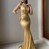 gold formal gown with plunging neckline, adjustable straps and figure hugging mermaid skirt