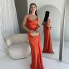 orange formal gown with cowl neckline, and cowl backline, slim straps and a flattering mermaid-like silhouette