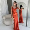 orange formal gown with cowl neckline, and cowl backline, slim straps and a flattering mermaid-like silhouette