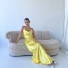 yellow formal gown with cowl neckline, and cowl backline, slim straps and a flattering mermaid-like silhouette