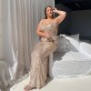 glittering, rose gold, floor length formal gown with spaghetti straps, slim silhouette and v-neckline