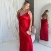 red formal gown with cowl neckline, and cowl backline, slim straps and a flattering mermaid-like silhouette