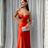 orange formal gown in bias cut silhouette with no zippers and pull on style
