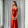 orange formal gown in bias cut silhouette with no zippers and pull on style
