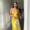yellow formal gown in bias cut silhouette with no zippers and pull on style