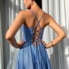 back view of blue glitter formal gown with deep v neck illusion, high side slit, lace up back, and spaghetti strap