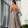copper glitter formal gown with deep v neck illusion, high side slit, lace up back, and spaghetti strap