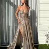 copper glitter formal gown with deep v neck illusion, high side slit, lace up back, and spaghetti strap