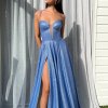 blue glitter formal gown with deep v neck illusion, high side slit, lace up back, and spaghetti strap