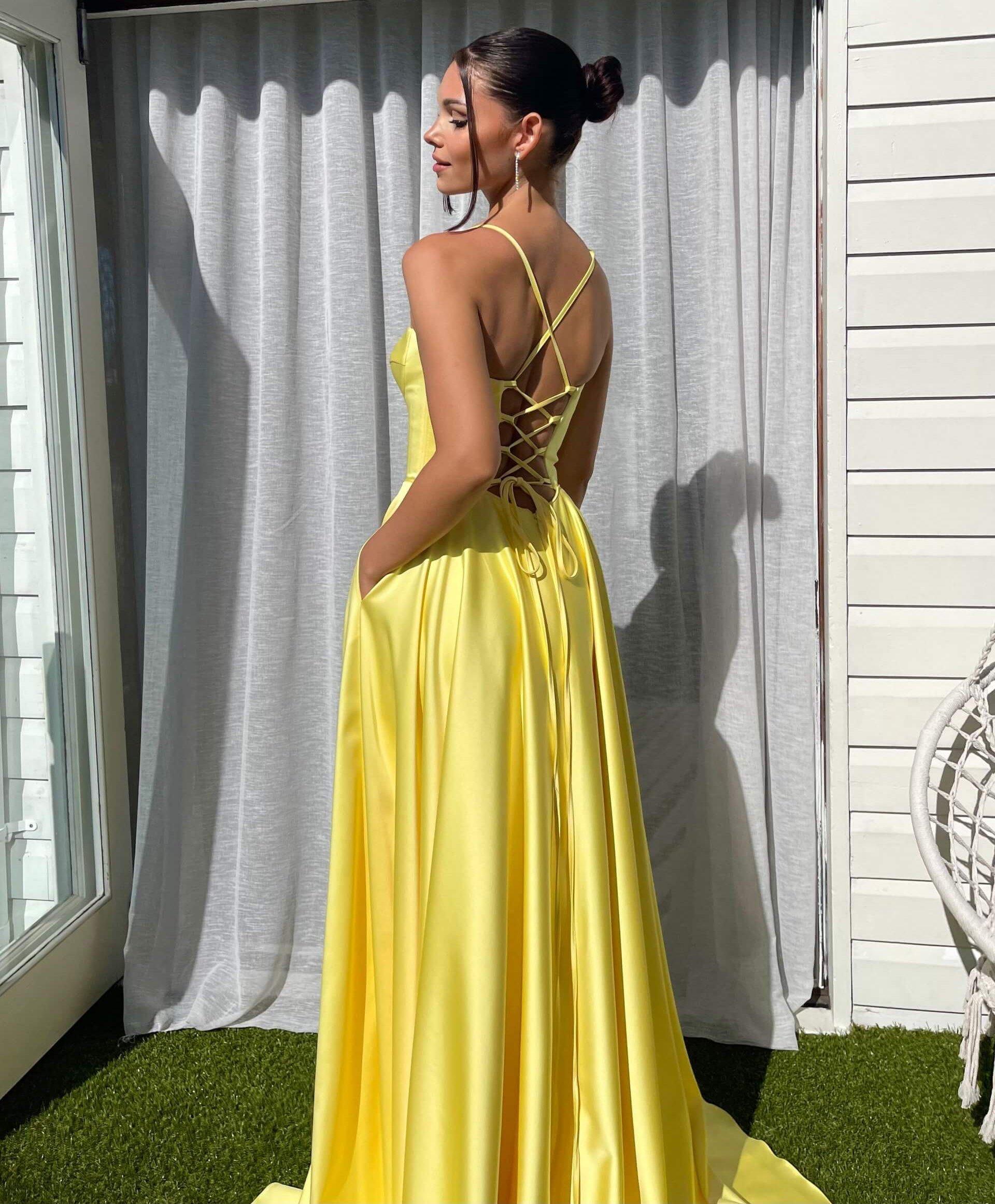 Smiling Woman in a Yellow Ball Gown · Free Stock Photo