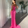 pink formal gown with exposed back, strapless, deep V neck and side high slit