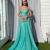 blue glitter gown with pockets, exposed back and fully lined