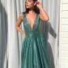 sage glitter gown with plunge neckline, open back and full luxe skirt with pockets