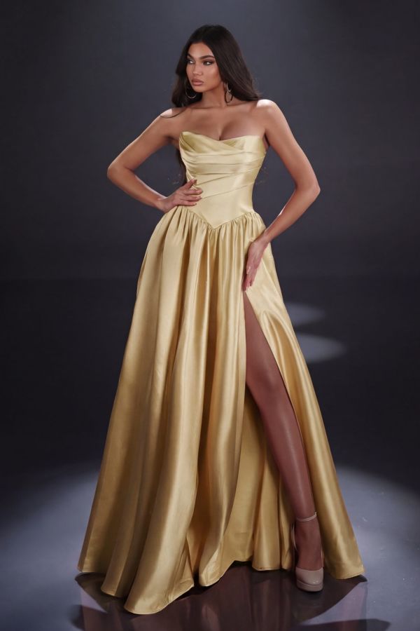 Clara Gown in Gold mikado featuring a strapless sweetheart neckline, draped bodice, drop waist, full skirt and high leg split.