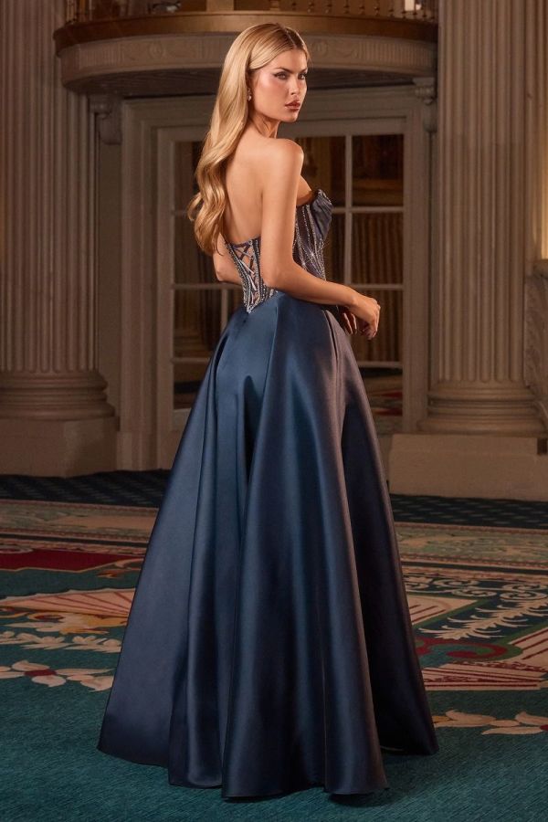 Back view of the Mary Gown in Navy satin featuring a crystal embellished corset bodice, lace-up back and full A-line skirt.