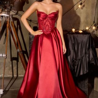 Violet Gown in burgundy mikado featuring a beaded sheer corset bodice, sweetheart neckline and full ballgown skirt.