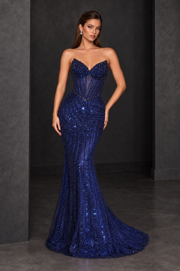 Coco Gown in Navy, featuring a strapless corset bodice, lace-up back, intricate beading and a fitted skirt with a sweeping train, shown from the back.