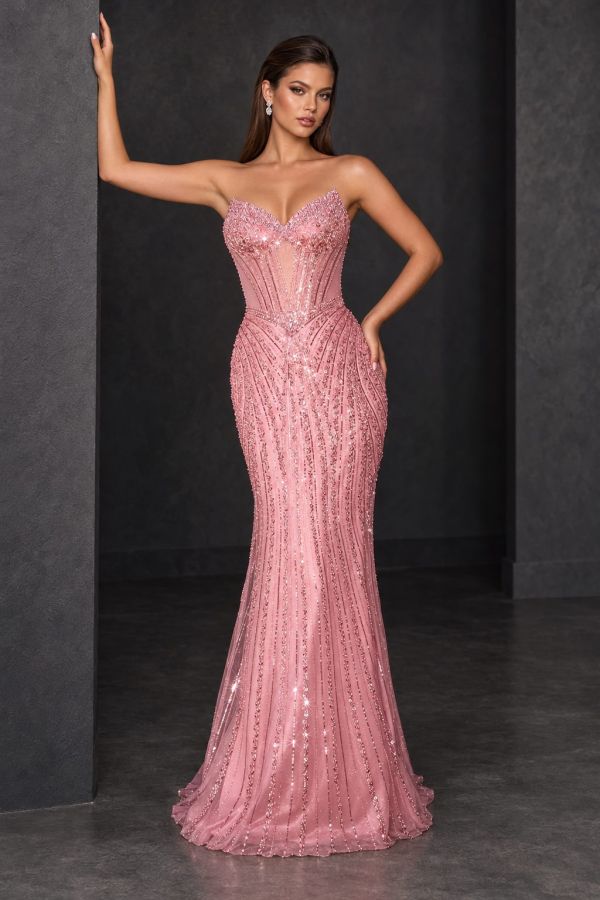 Coco Gown in rose pink, featuring a strapless corset bodice, lace-up back, intricate beading and a fitted skirt with a sweeping train, shown from the back.