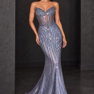 Coco Gown in Silver Blue, featuring a strapless corset bodice, lace-up back, intricate beading and a fitted skirt with a sweeping train, shown from the back.